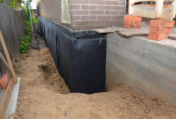 Happy homeowners after waterproofing job in Wakarusa